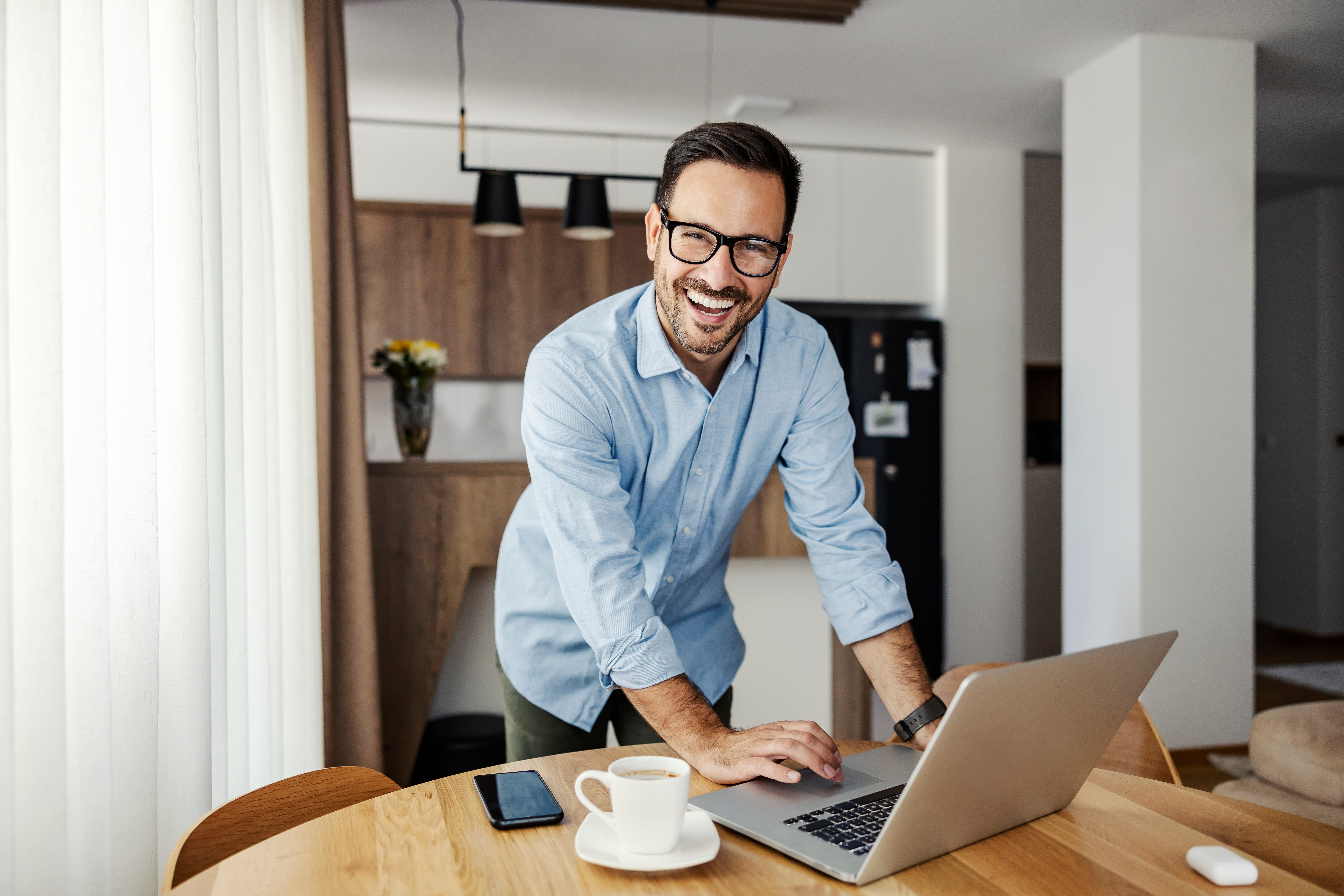 remote worker using a laptop at home to manage mail and business tasks with a virtual address